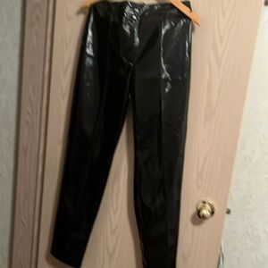 Black shiny leather looking pants. Made by only